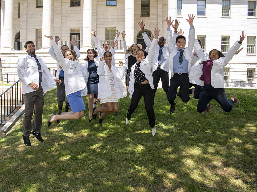 Surgery residents jumping outside