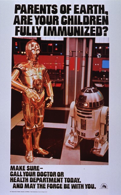 C-3PO and R2-D2 stand on a Star Wars set. The futuristic lettering reads, "Parents of Earth, are your children fully immunized? Make sure--call your doctor or health department today. And may the Force be with you."