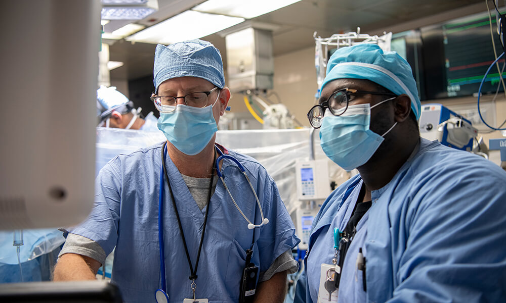(Left) Michael Fitzsimons, MD, anesthesiologist, and (right) Samwel Ochieng, MD, resident