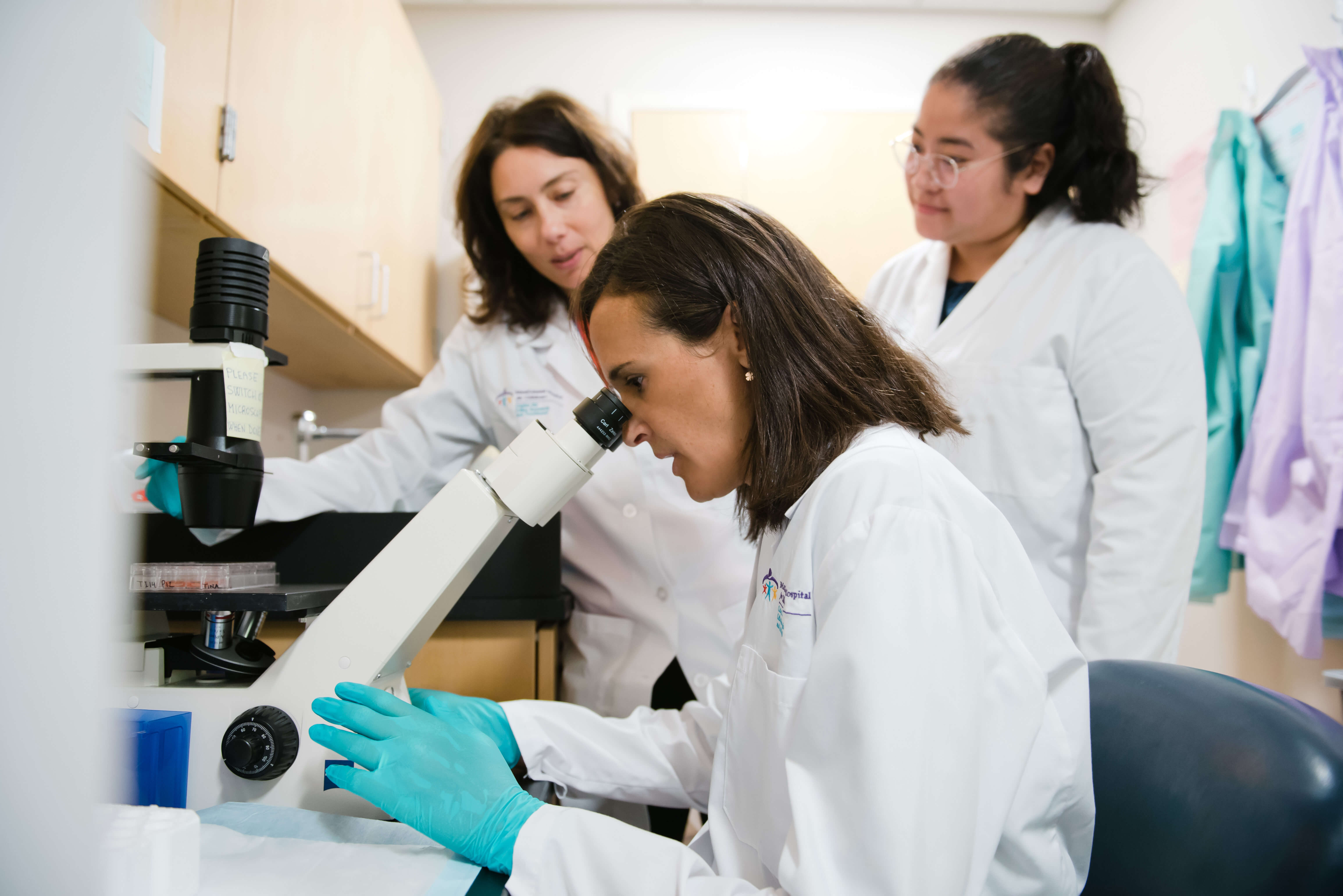 Three female researchers in the lab
