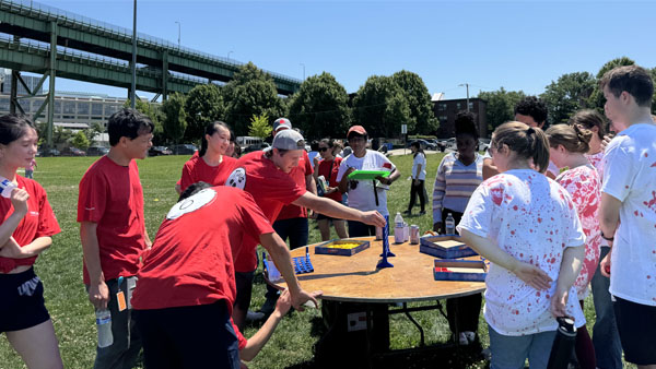 Lab members playing connect four in the lab olympics