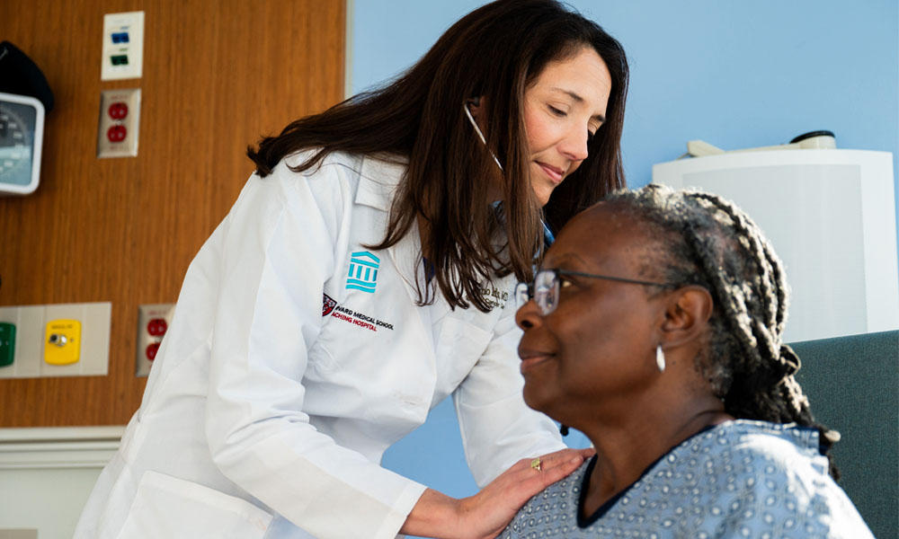 Kerry Reynolds, MD with a patient at the Mass General Cancer Center
