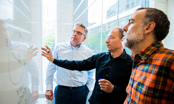 Physicists discussing research at Mass General Cancer Center.