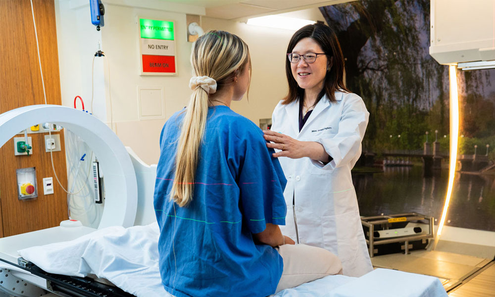 Helen Shih, MD with a proton therapy patient