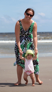 Catherine Aftandilian and her baby daughter at the beach