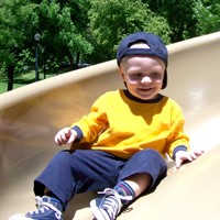 Charlie Beecher, 16 months old, on a slide