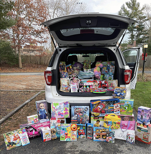 Donated toys being loaded into a van to drop off at MGHFC.