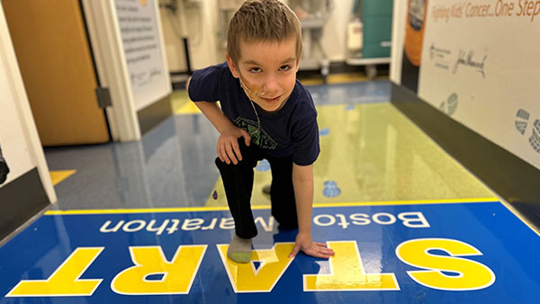 Theo running in the MGH pediatric oncology clinic