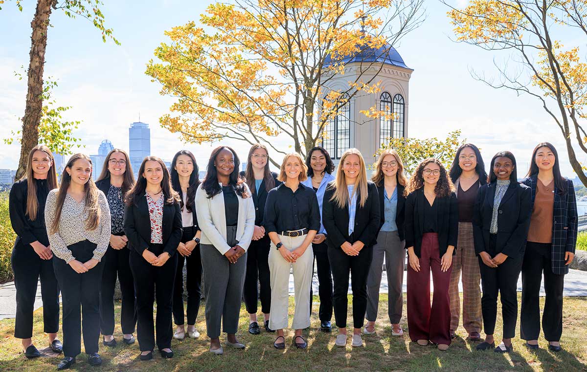 The 2025 Pharmacy residents in a courtyard with trees and a cupola behind them.