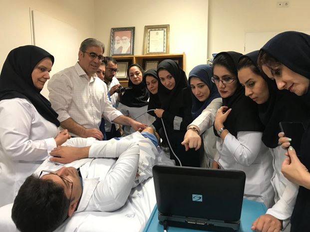 Fellows look on during a medical simulation