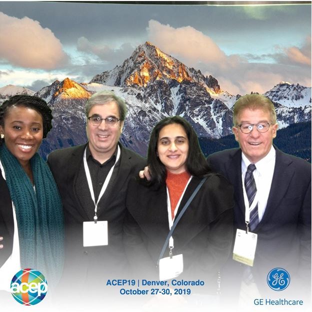 Members pose during the ACEP19 event with a mountain backdrop