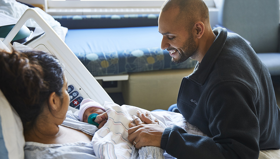 family in postpartum room