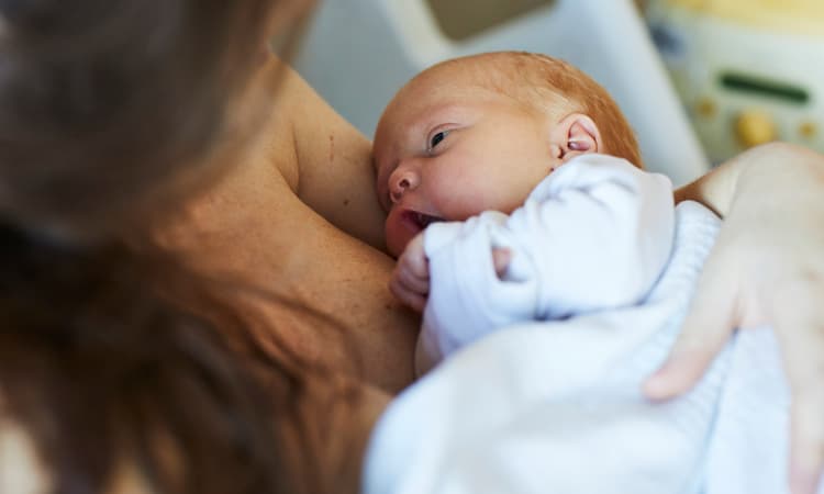 New parent holding newborn baby New parent holding newborn baby