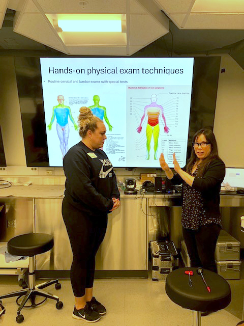 Leah Witkin, PA, with the Orthopedic Spine Service, presenting to a cohort of students at the onsite skills workshop