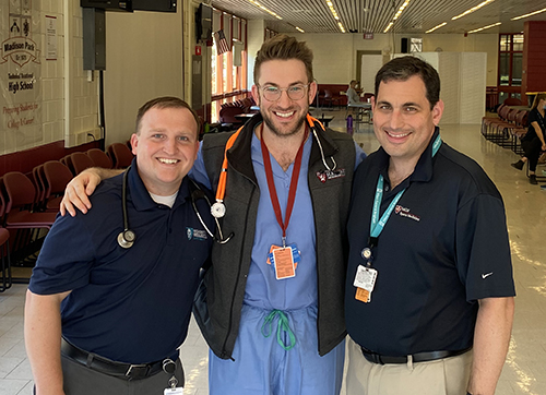 Dr. Gregory Waryasz, Dr. David Bernstein and Dr. Eric Berkson, three orthopaedic clinicians who participated in the free physical program for Boston Public School students
