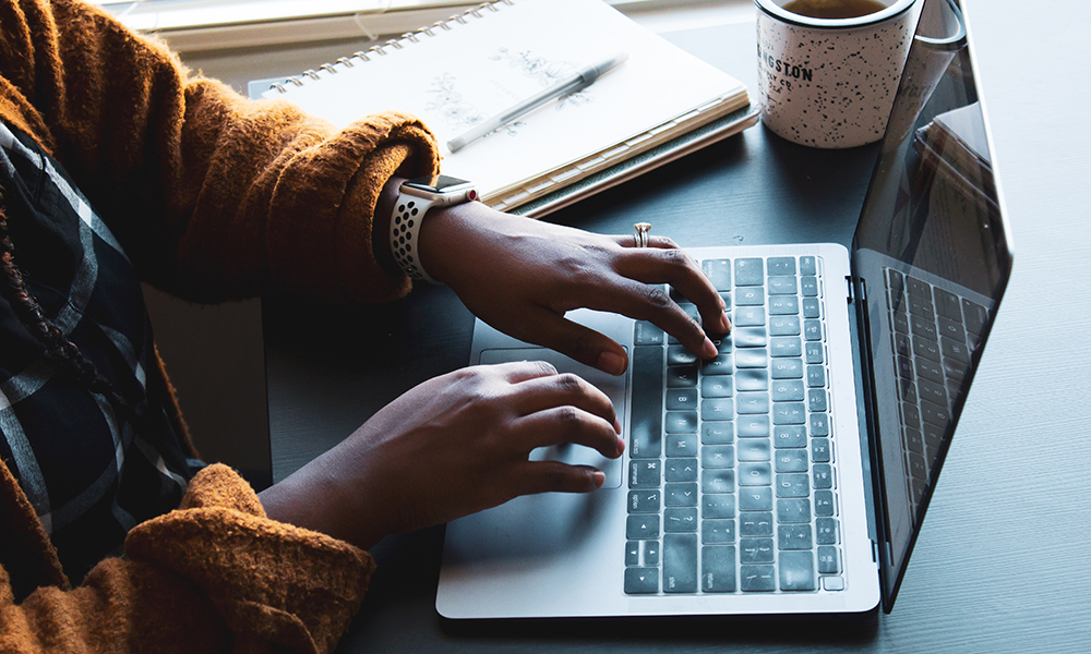 Picture of a person working on a laptop