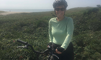 Janet, a patient of Dr. Daniel Tobert, biking on Nantucket.