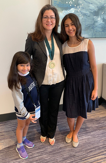 Dr. Ebru Oral with her two daughters at the induction ceremony for the National Academy of Inventors