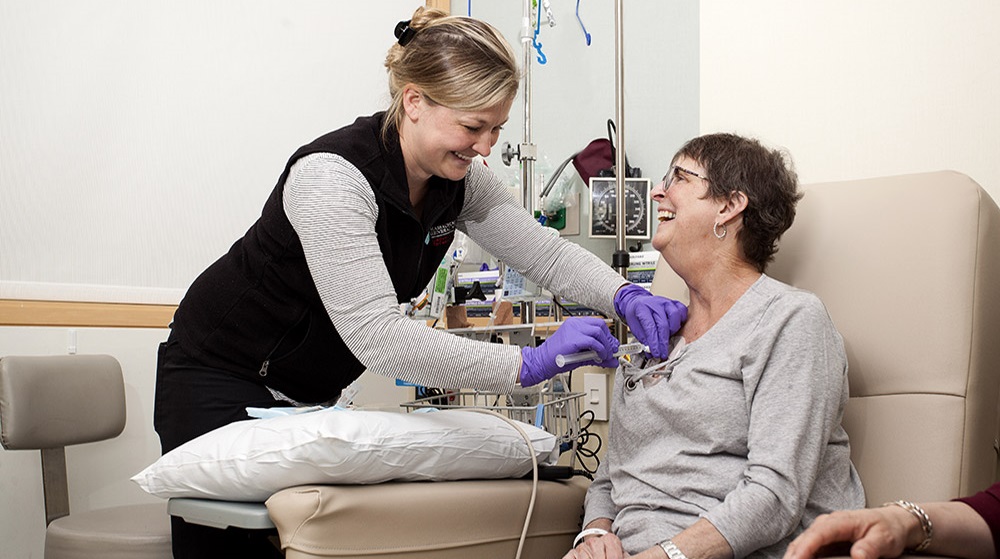 Smiling patient with nurse