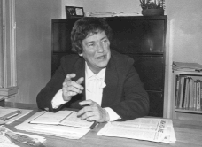 Picture of former Director of Mass General Social Service Eleanor Clark sitting at desk.