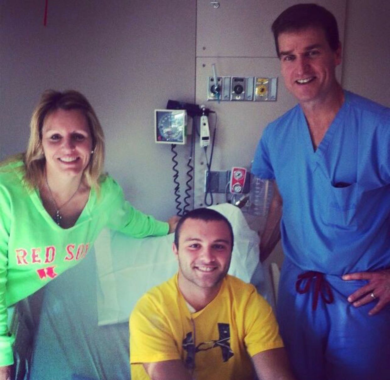 Brett Smart in recovery alongside his mother, Kerri, and Dr. Donahue 