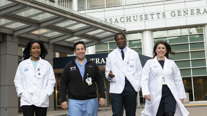 CDI members walking outside the hospital's main entrance. CDI members walking outside the hospital's main entrance.