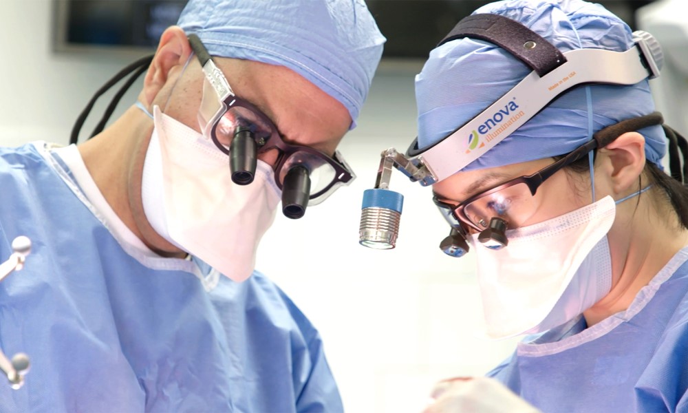 Neurosurgeons conducting brain surgery Neurosurgeons conducting brain surgery