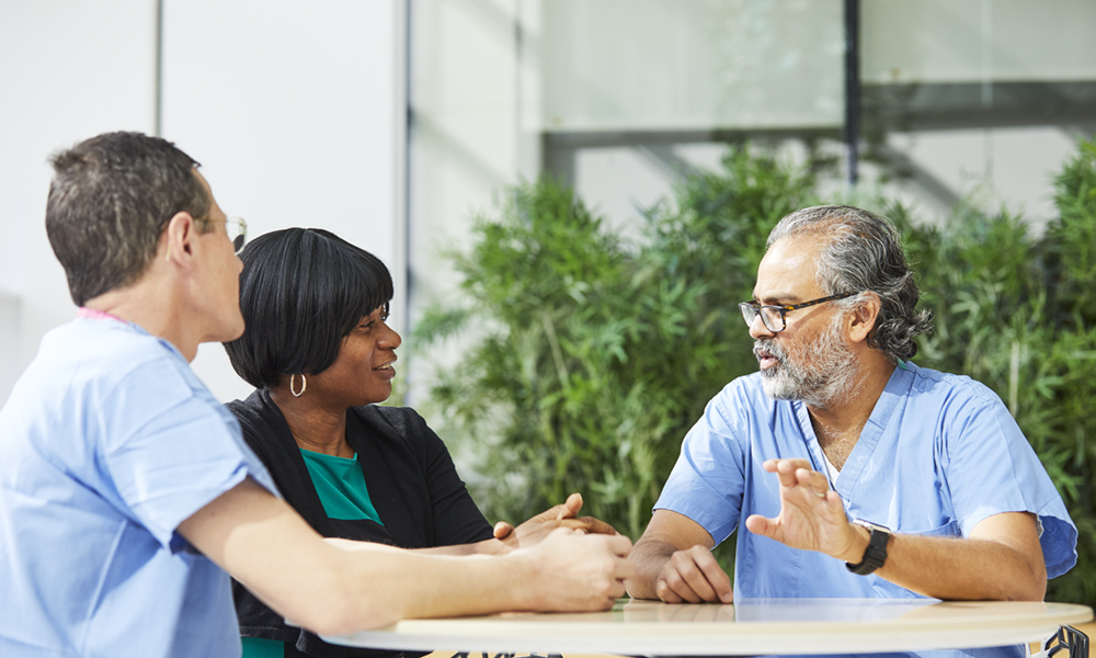 Physicians with a patient Physicians with a patient