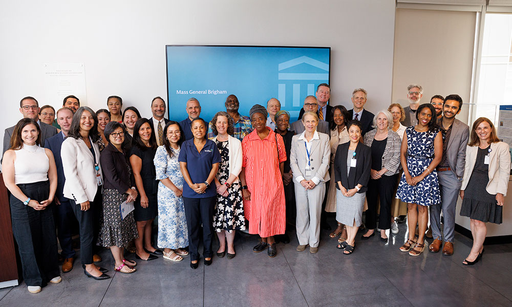 Recipients of Mass General Brigham's housing grants pose with legislators and MGB leadership. Recipients of Mass General Brigham's housing grants pose with legislators and MGB leadership.