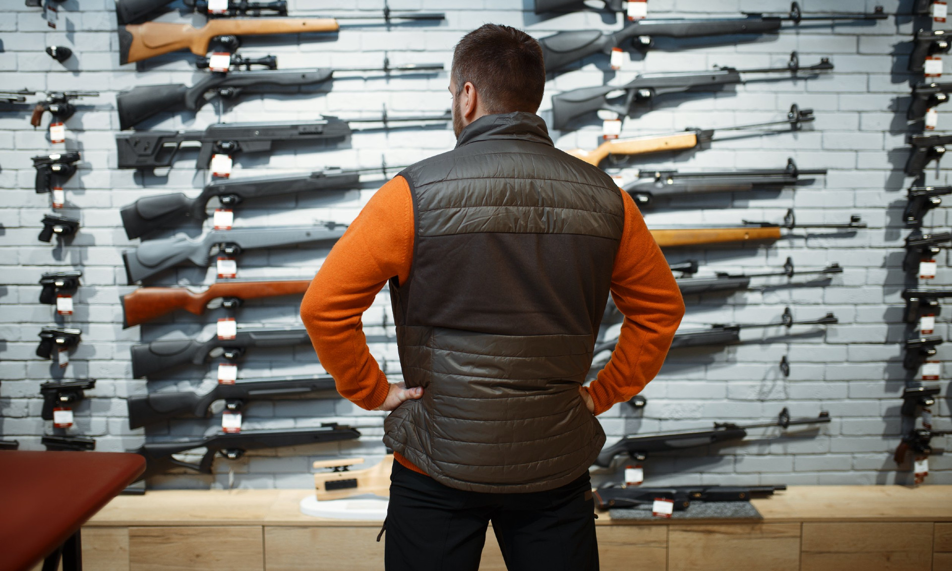 Image of a man in a gun store Image of a man in a gun store
