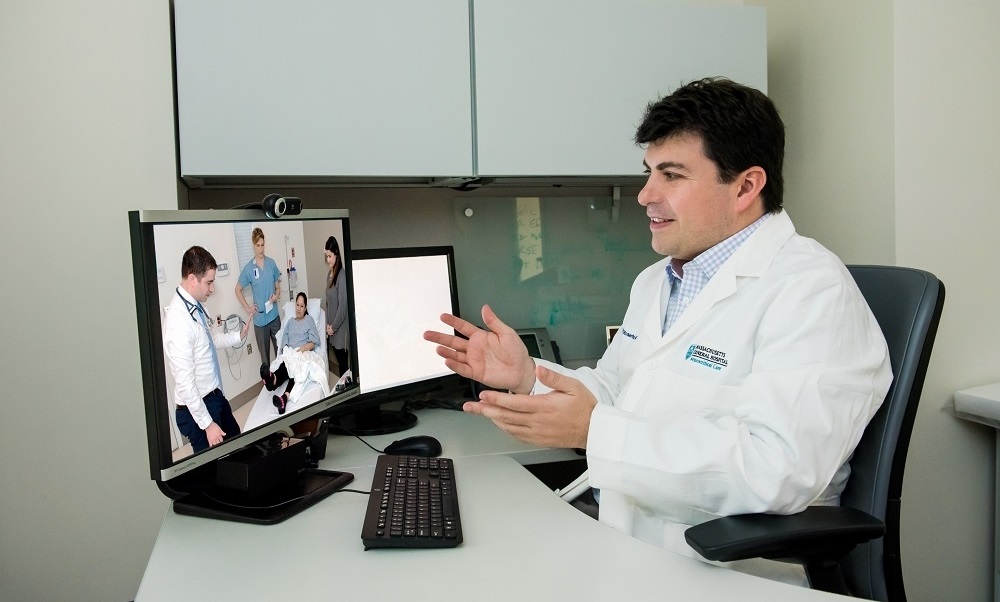 A doctor offers telehalth services via his computer A doctor offers telehalth services via his computer