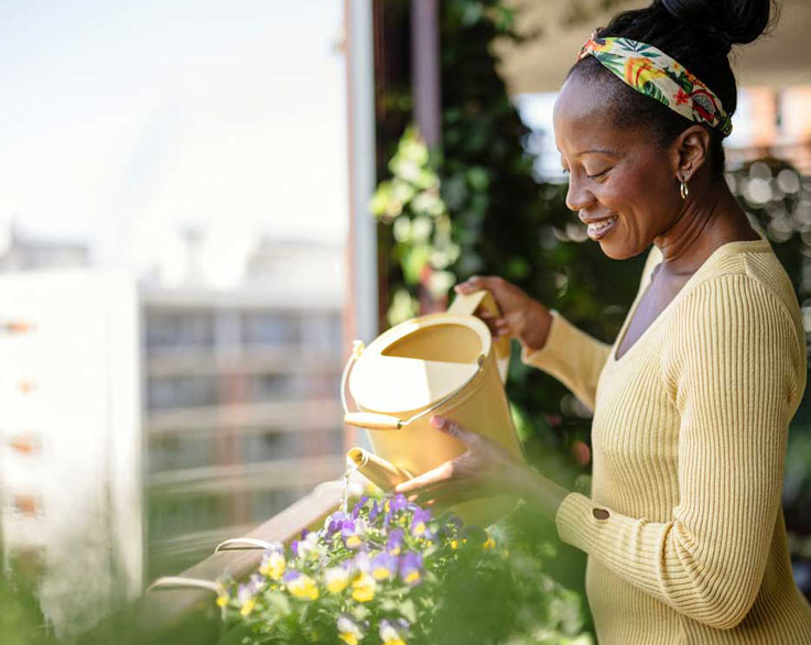 Woman watering flowers