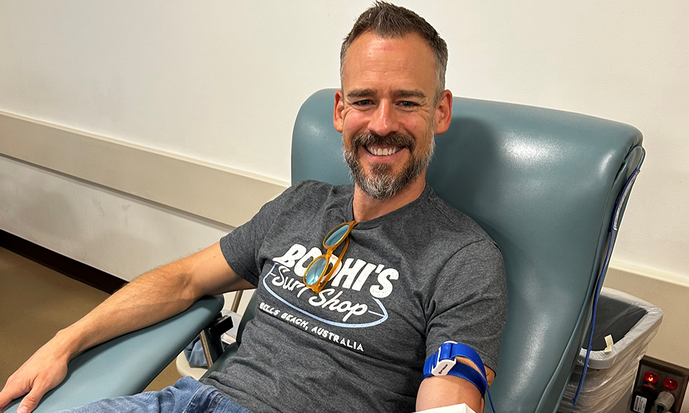 man donating blood in chair smiling man donating blood in chair smiling