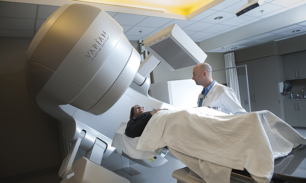 Radiation therapist with patient. Radiation therapist with patient.