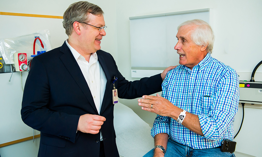 Dr. Jason Efstathiou with patient. Dr. Jason Efstathiou with patient.