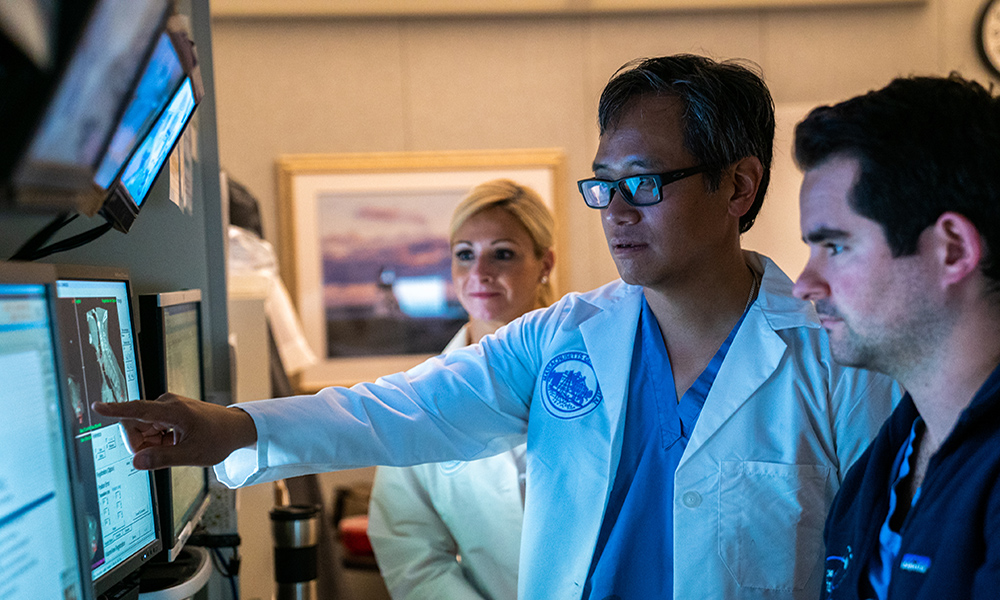 Radiation oncologist Ted Hong, MD (middle) with colleagues at Mass General Cancer Center. Radiation oncologist Ted Hong, MD (middle) with colleagues at Mass General Cancer Center.