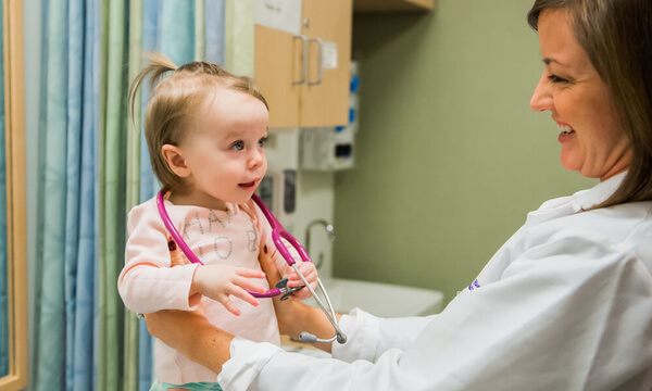 Maureen Leonard, MD, with a pediatric patient Maureen Leonard, MD, with a pediatric patient