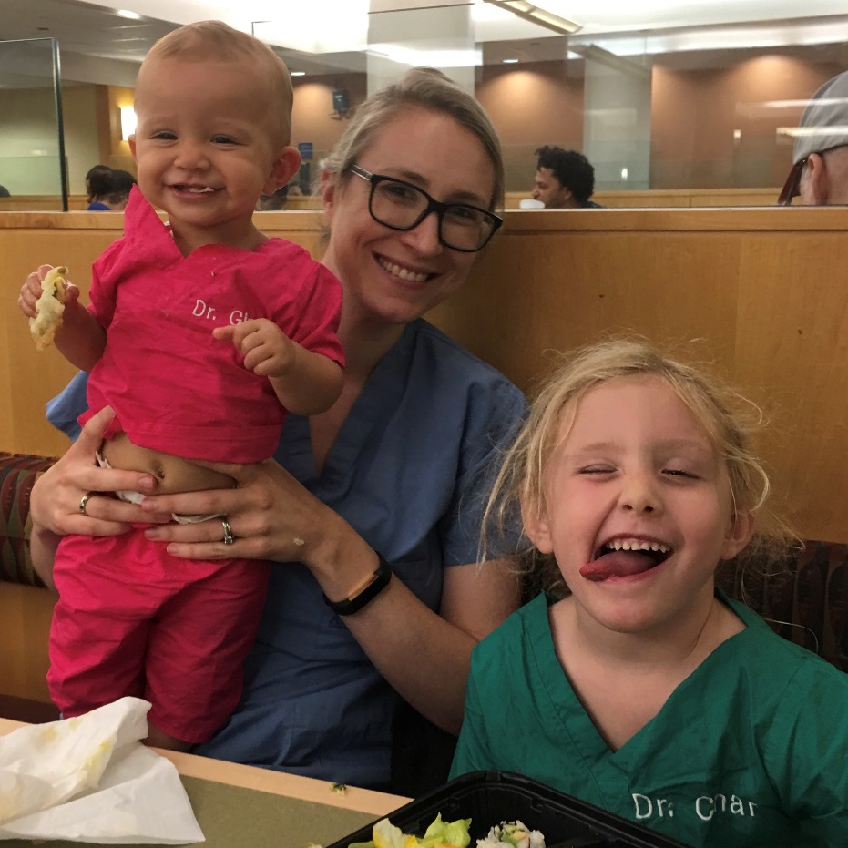 Anna Goldenheim and her two small children mug at a restaurant