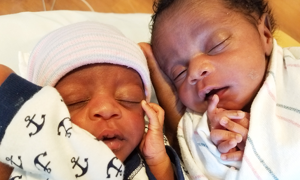Mihaly and her brother side by side, wrapped in blankets, shortly after birth. Mihaly and her brother side by side, wrapped in blankets, shortly after birth.