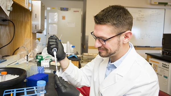 A researcher in the lab at the MIBRC