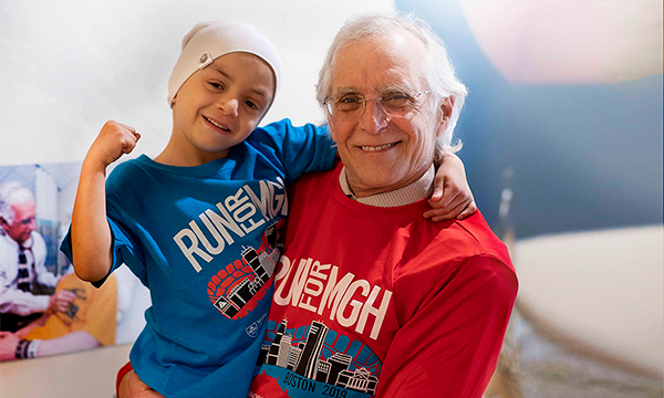 Photo of pediatric oncology patient Cris with Dr. Howard Weinstein Boston Marathon pasta dinner Photo of pediatric oncology patient Cris with Dr. Howard Weinstein Boston Marathon pasta dinner