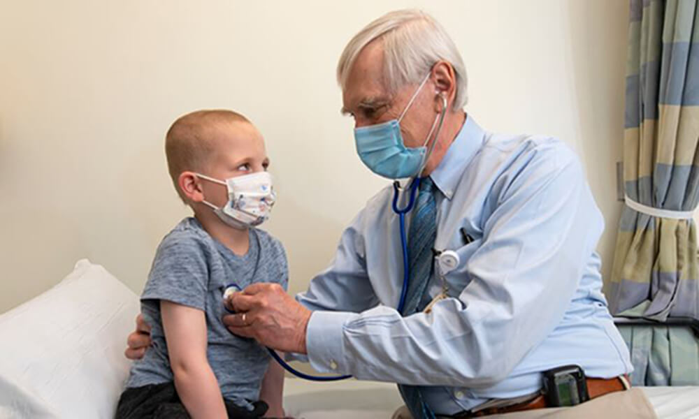 A smiling patient is attended to by a nurse A smiling patient is attended to by a nurse