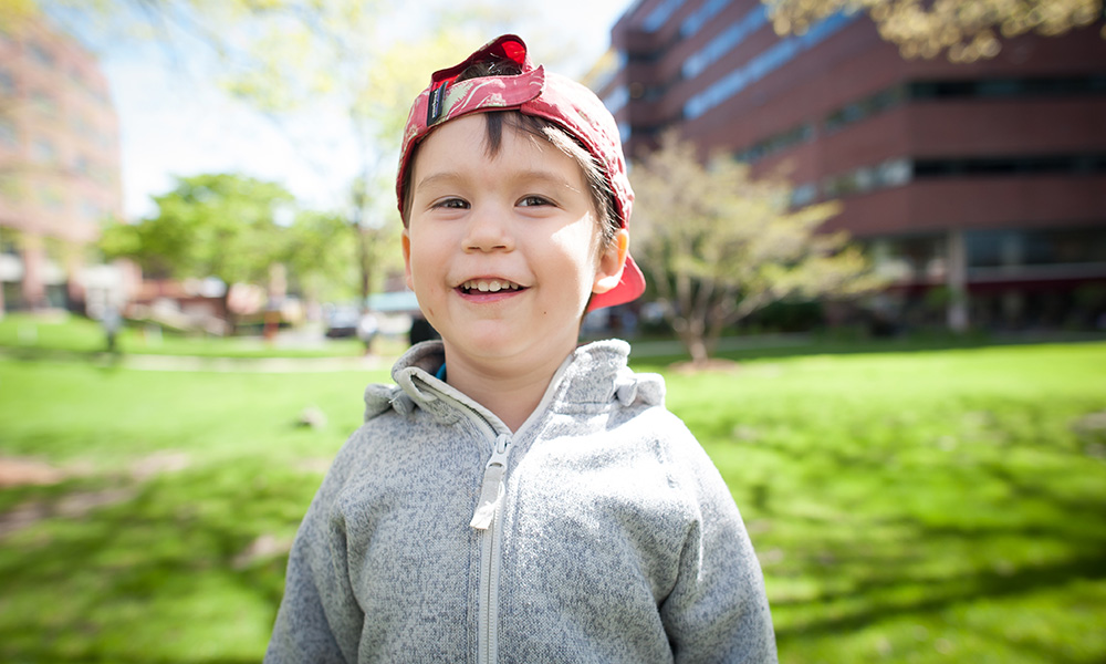 Proton Therapy patient Emilio smiles on the Bulfinch lawn Proton Therapy patient Emilio smiles on the Bulfinch lawn