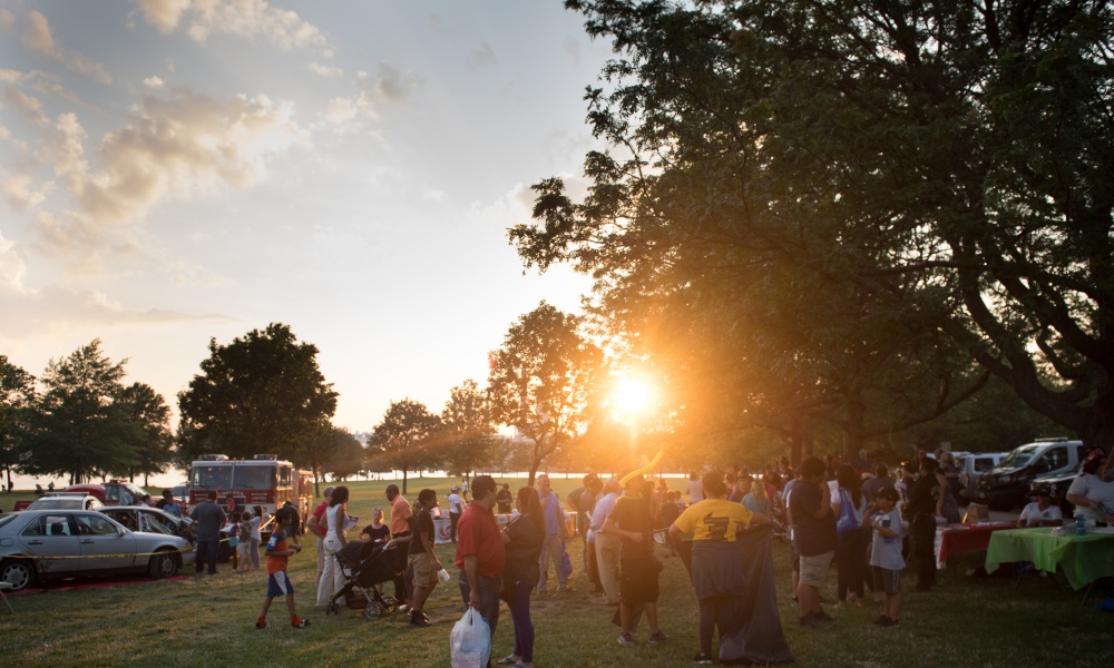 Sunrise over a community event in the park. Sunrise over a community event in the park.