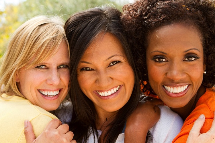 Three attractive women with different skin tones. Three attractive women with different skin tones.