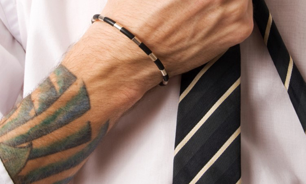 Business man with tattoo on arm. Business man with tattoo on arm.