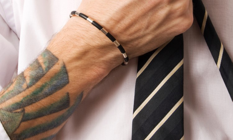 Business man with tattoo on arm. Business man with tattoo on arm.