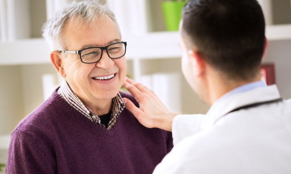 Doctor with smiling patient in clinic Doctor with smiling patient in clinic