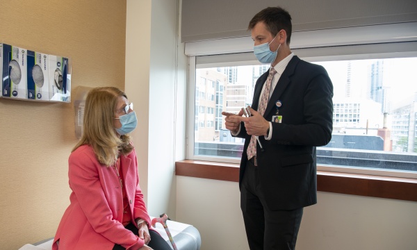 Dr. Klawiter speaks with a patient during an exam Dr. Klawiter speaks with a patient during an exam