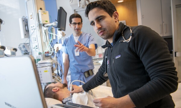 Doctors examine an ultrasound in the neurocritical care unit Doctors examine an ultrasound in the neurocritical care unit
